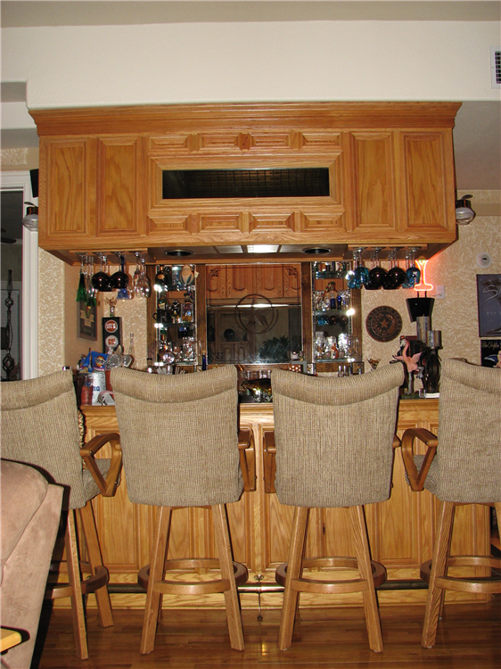 A Custom Natural Red Oak Bar With Complimenting Rear Wet Serving Area