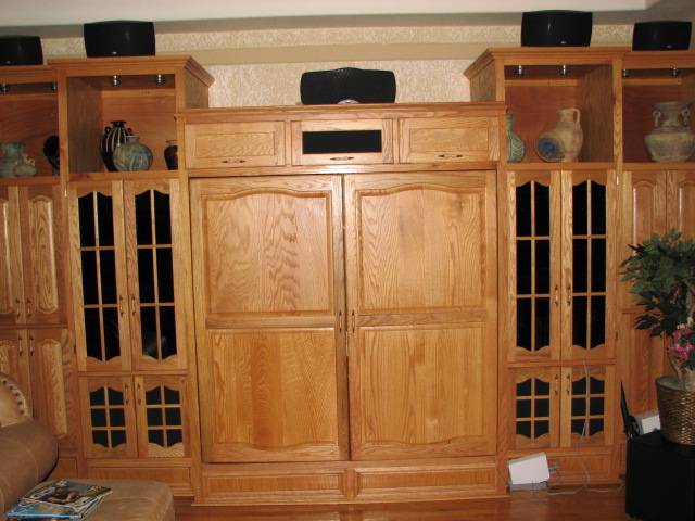 A Custom Natural Red Oak Entertainment Center Housing a Big Screen TV