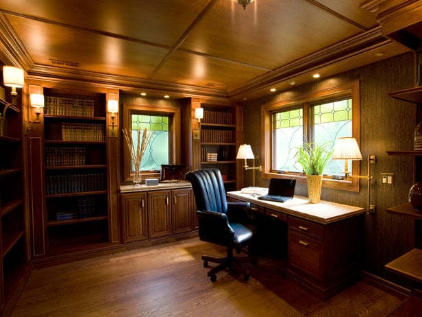 A home office with a warm wooden ceiling